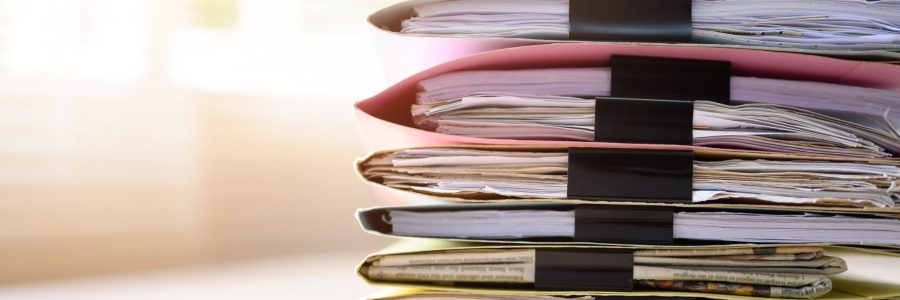 Documents in files placed on the office desk